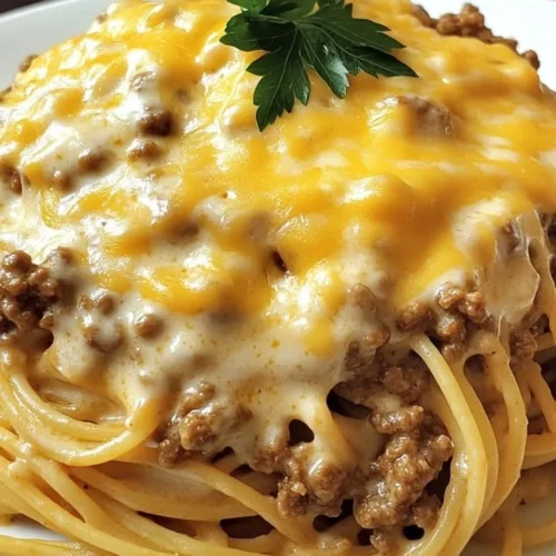 Cheesy beef spaghetti in savory garlic cheddar butter cream served in a bowl
