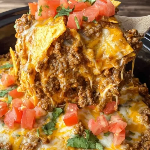 Delicious Crockpot Taco Casserole served in a dish with toppings.