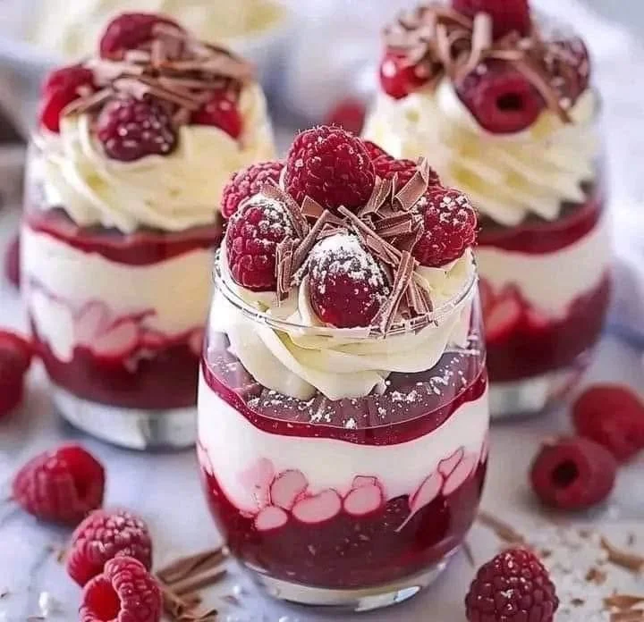 Heavenly raspberry mousse parfait with white chocolate topping
