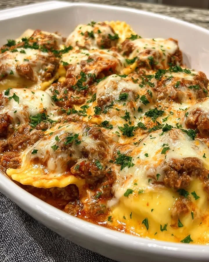 Plate of Million Dollar Ravioli garnished with fresh herbs and sauce